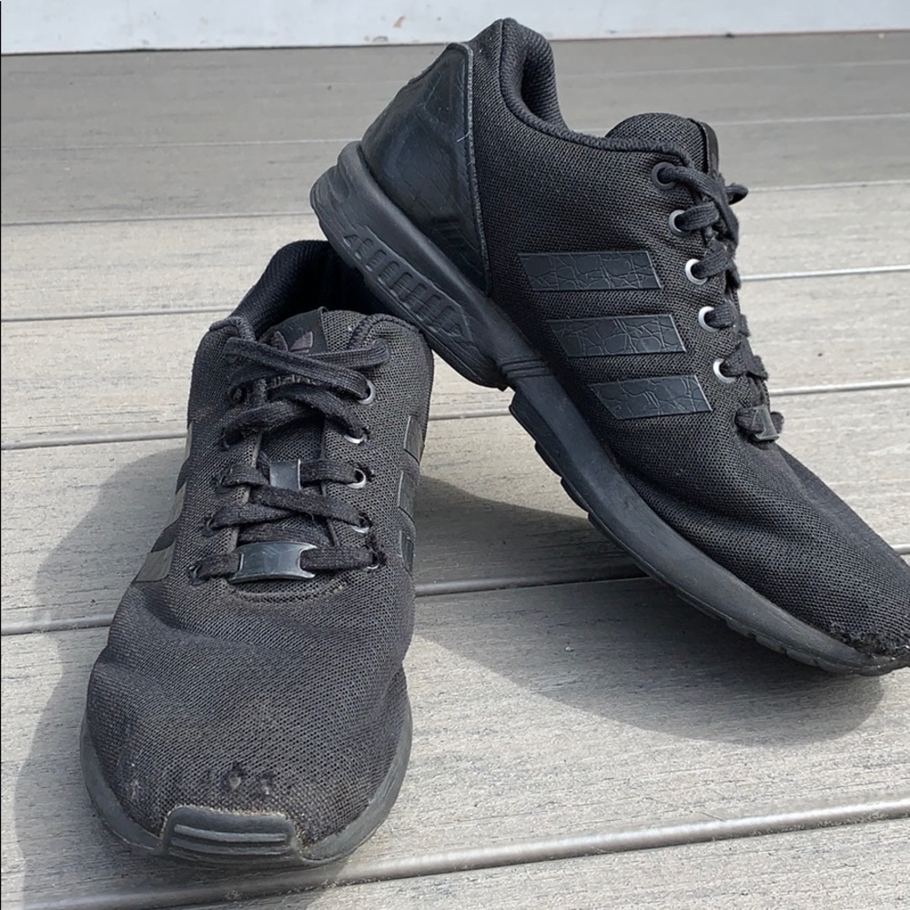 All black adidas Torsion